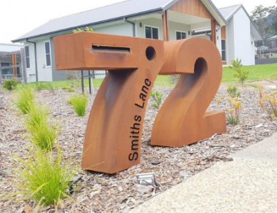 Large Numeral free standing Letterbox 7 & 2 in Rusted Corten Steel pillar style