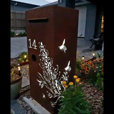 3D Grevillea Letterbox in Rusted Corten Steel with Perspex Backing at Night 3D Grevillea Letterbox with Bees in Rusted Steel with Perspex