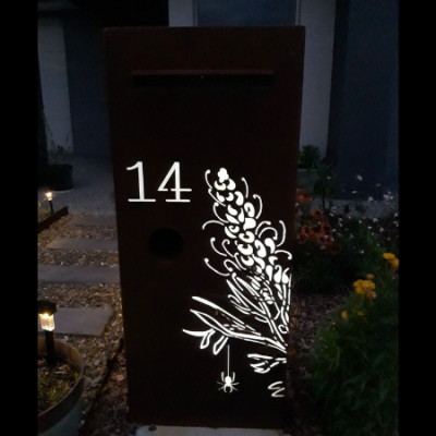 3D Grevillea Letterbox in Rusted Corten Steel with Perspex Backing at Night 3D Grevillea Letterbox with Bees in Rusted Steel with Perspex