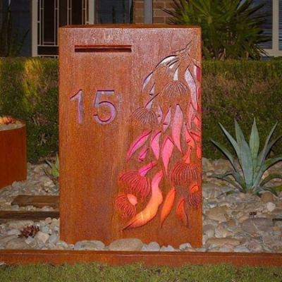 Wide Form Letterbox with Gumleaf Cascade in Rusted Corten Steel with Perspex Backing- Dapto Wide Form Letterbox with Gumleaf Cascade in Rusted Corten Steel with Perspex Backing- Dapto