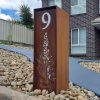 Compact free standing Letterbox in Cor-ten steel with natural rust finish. unique Grevillea Pattern mailbox