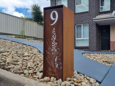 Compact free standing Letterbox in Cor-ten steel with natural rust finish. unique Grevillea Pattern mailbox