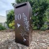 Medium free standing pillar Letterbox in Powder Coated aluminium. Unique Grevillea with Bees pattern on mailbox.