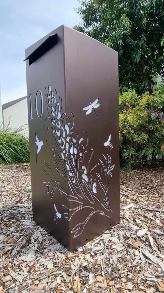 Medium Letterbox in Powder Coated aluminium. Grevillea with Bees pattern.