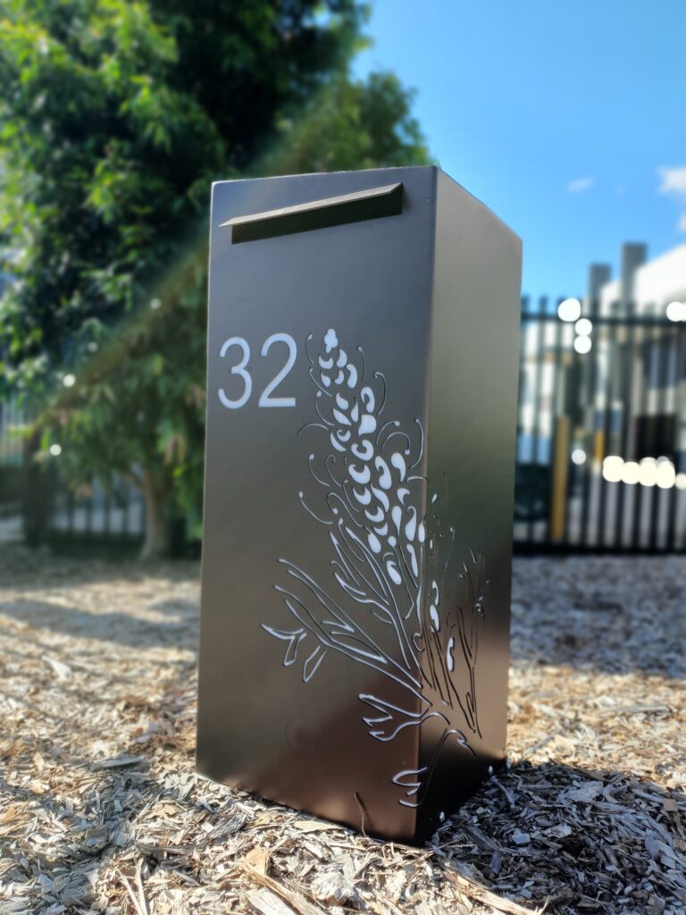 Medium Letterbox in Powder Coated aluminium. Grevillea pattern. Sloping roof.