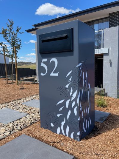 Monument Standard LB PC Ali Gumleaf Cascade 3 Standard Letterbox in Powder coated aluminium. Gum Leaf Cascade pattern. Black face plate.