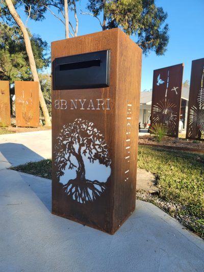 Std LB Figtree - Rust, perspex, black chute 1.0 Standard Letterbox in Cor-Ten steel. Figtree pattern. Perspex & Black face plate.