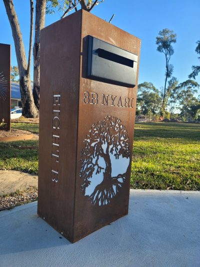 Std LB Figtree - Rust with Black chute Standard Letterbox in Cor-Ten steel. Figtree pattern. Perspex & Black face plate.