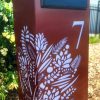 Standard Letterbox in Powder coated aluminium. Floral pattern. Black face plate.