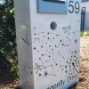 Custom Metal Free standing Parcel Letterbox in Powder coated aluminium . Dandelion Breeze & dragonfly pattern. & Silver face plate.