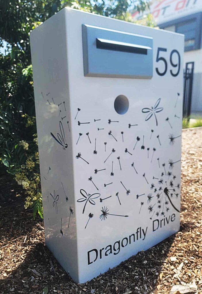 Custom Metal Free standing Parcel Letterbox in Powder coated aluminium . Dandelion Breeze & dragonfly pattern. & Silver face plate.
