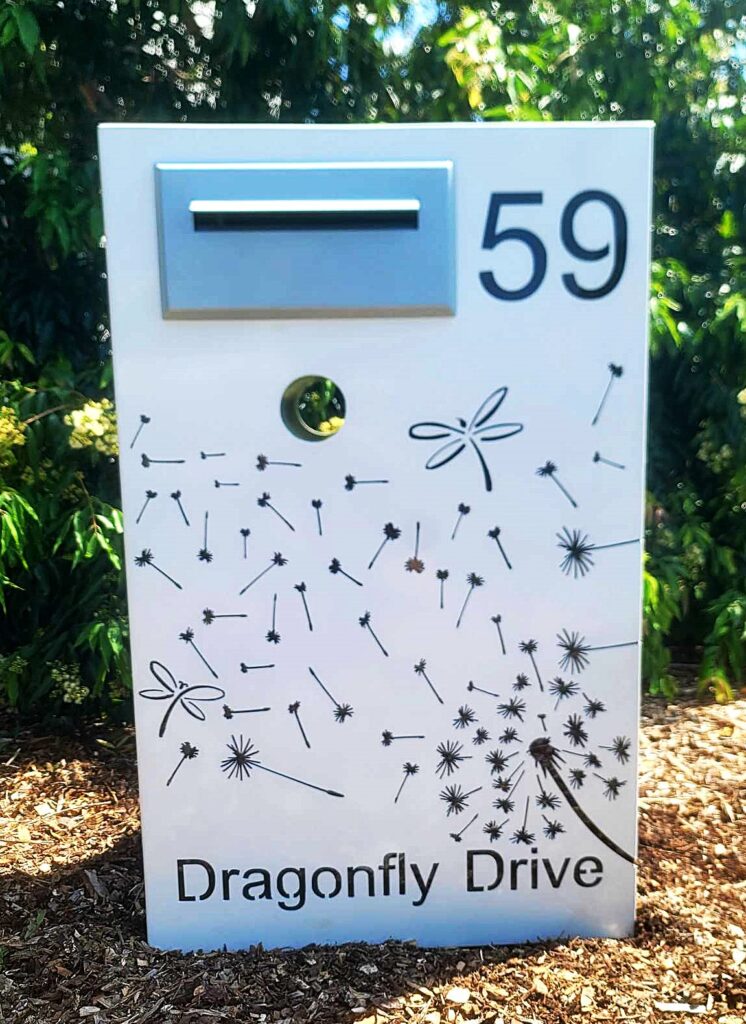 Custom Metal Free standing Parcel Letterbox in Powder coated aluminium . Dandelion Breeze & dragonfly pattern. & Silver face plate.