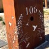 Custom Metal Free standing Parcel Letterbox in Cor-Ten Steel. Grevillea with Honey eater pattern. Perspex.