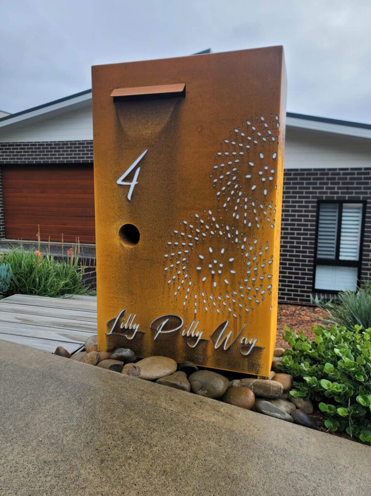 Custom Metal Free standing Parcel Letterbox in Cor-Ten steel. Fanfare pattern.